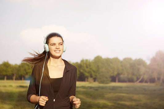 A woman jogging after learning how to increase NAD+ levels naturally